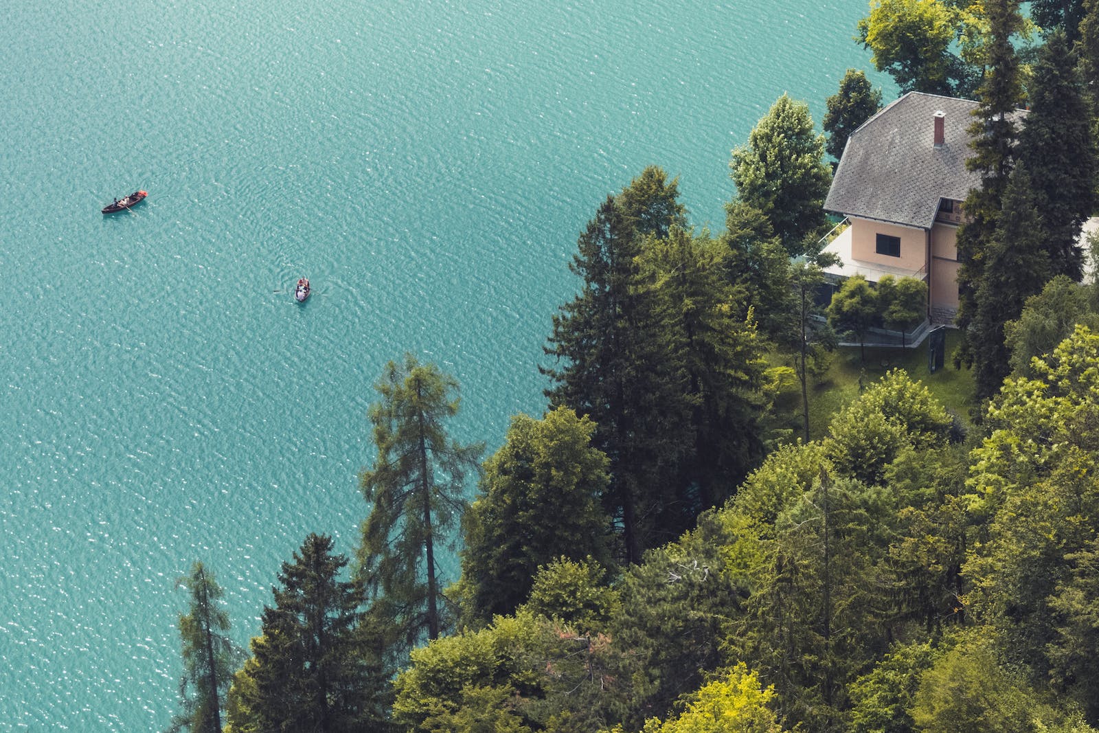 Aerial Shot of a House Overlooking Lake Bled